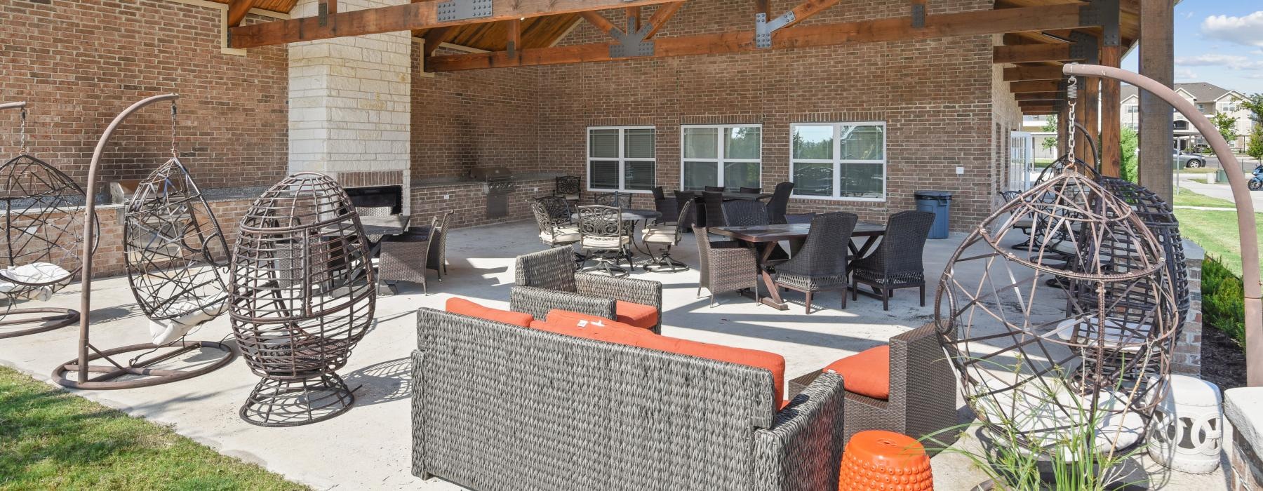 a patio with a table and chairs