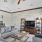 a living room with a tv and couches