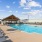 A swimming pool with lounge chairs at Icon Apartments for rent in Killeen, TX