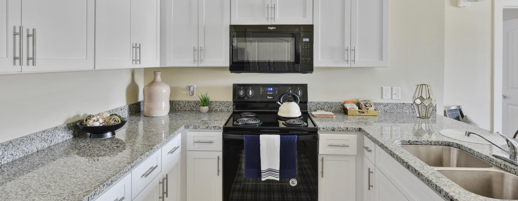 a kitchen with white cabinets