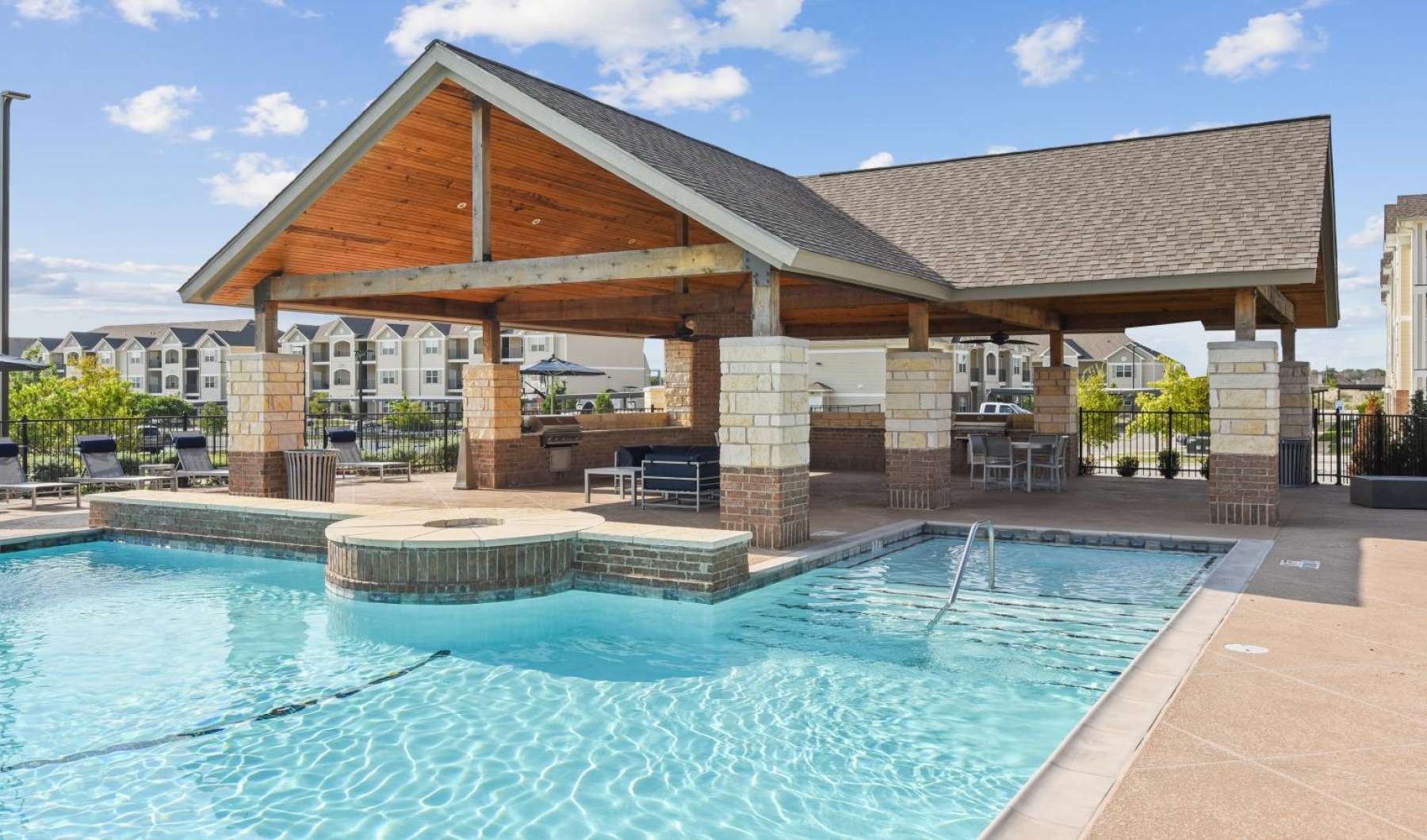 a swimming pool in front of a building