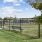 green area with fenced in pet play zones