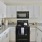 a kitchen with white cabinets