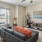 a living room with a couch and a fan