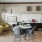 a living room with a table and chairs