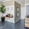 a kitchen with a table and cabinets