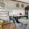 a living room with a table and chairs